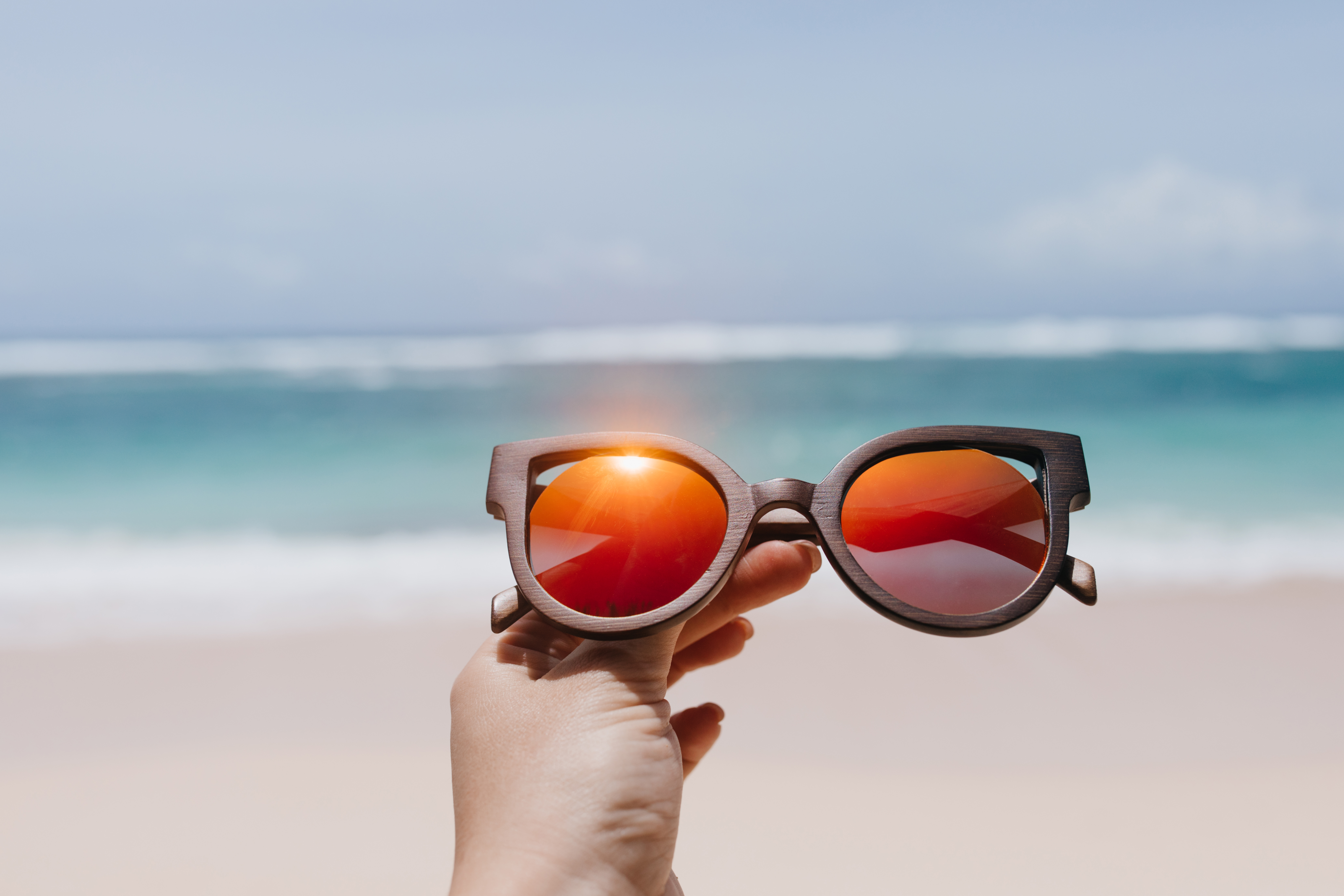 Choose your style like you choose your friends. Studio shot of two young  women wearing sunglasses against a turquoise background Stock Photo - Alamy